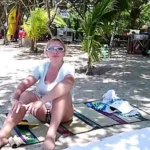 Couple’s excitation ignites under tropical moonlight.