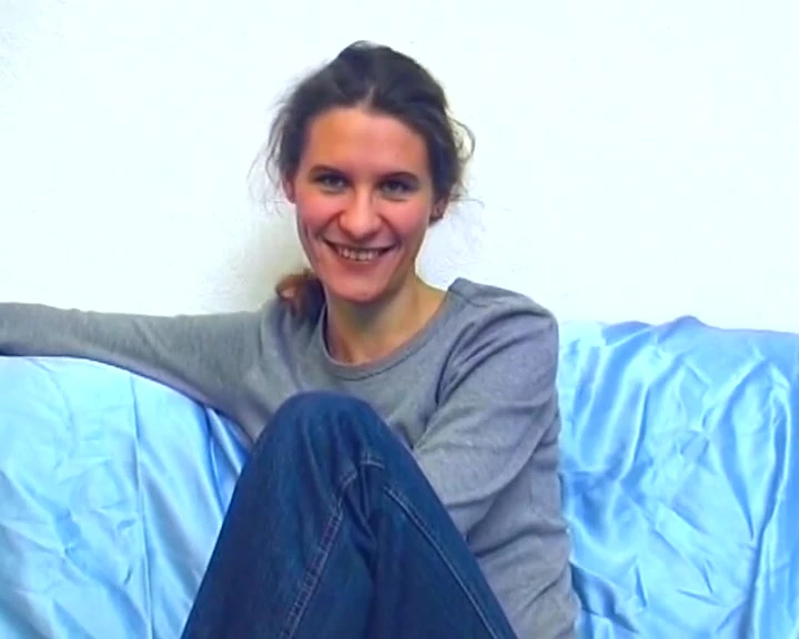 Stunning brunette German beauty exposes her shaved pussy on camera.